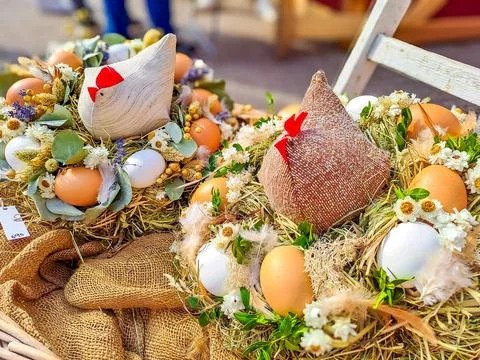 Happy Easter. Congratulatory easter background. Easter eggs hen and flowers. Stock Photos