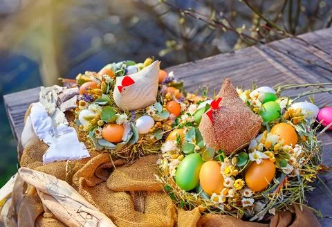 Happy Easter. Congratulatory easter background. Easter eggs hen and flowers. Stock Photos