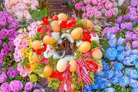 Happy Easter. Congratulatory easter background. Easter eggs and flowers. Stock Photos