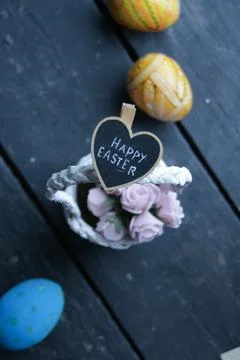 Happy Easter. Congratulatory Easter background. Easter eggs and flowers. Stock Photos