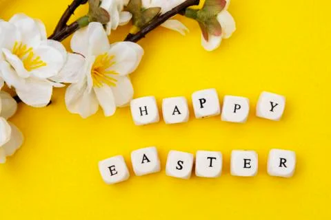 Happy Easter. Cubes with text on yellow background. Spring brunches with whit Stock-Fotos