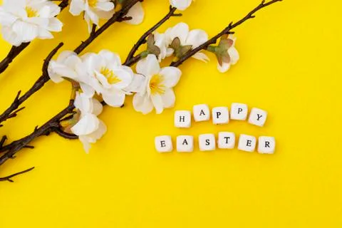 Happy Easter. Cubes with text on yellow background. Spring brunches with whit Stock-Fotos