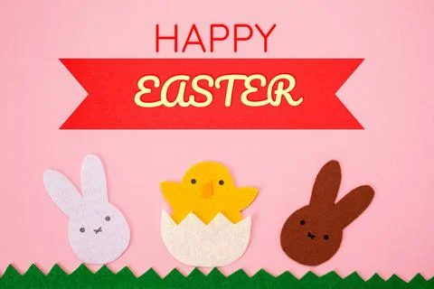 Happy Easter. Cut out the felt applications of white and brown rabbits and .. Stock Illustration