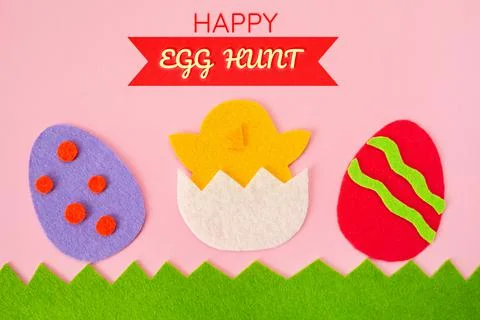 Happy Easter. Cut out the felt applications of colorful eggs and the chicken  Stock Photos