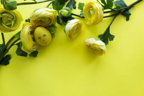 Happy Easter Day Around Yellow Flowers With Yellow Smiling Egg On a Yellow Ba Stock Photos
