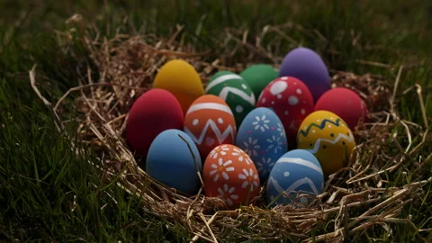Happy Easter Day. Easter eggs on green grass background, Dolly shot. Stock Footage 148988930
