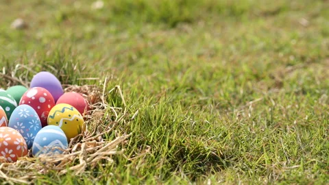 Happy Easter Day. Easter eggs on green grass background, Dolly shot. Stock Footage 148989694