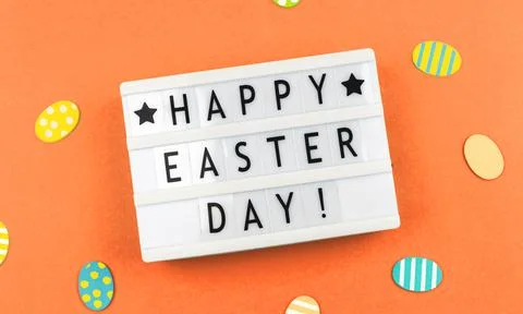 Happy Easter Day text background with greetitngs and easter eggs, orange pape Foto stock