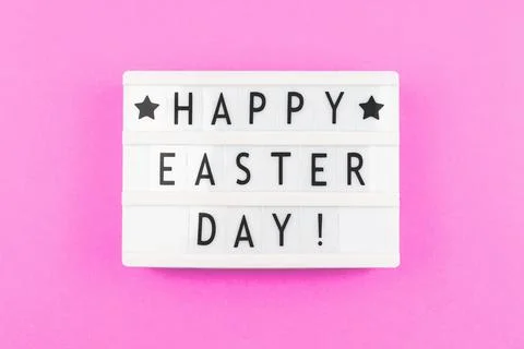 Happy Easter Day text greeting card concept with lightbox on a purple backgro Stock Photos