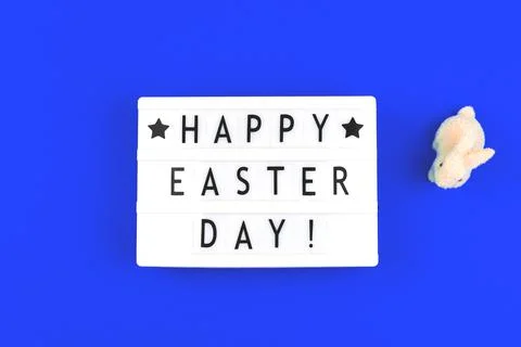 Happy Easter Day text on lightbox, festive background for holidays Stock Photos