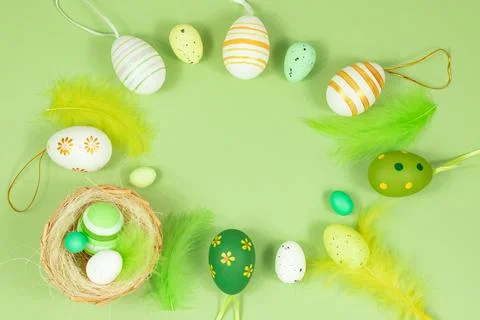 Happy easter. Delicate, pastel salad background with a nest, colorful eggs and Stock Photos