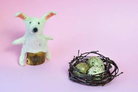 Happy Easter. DIY bunny, eggs and flowers on pink background. Easter card i.. Stock Photos