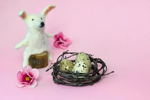 Happy Easter. DIY bunny, eggs and flowers on pink background. Easter card i.. Stock Photos