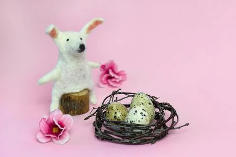 Happy Easter. DIY bunny, eggs and flowers on pink background. Easter card i.. Stock Photos