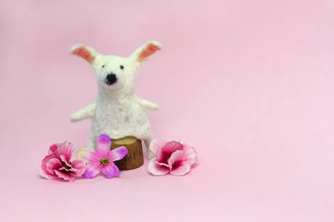 Happy Easter. DIY bunny, eggs and flowers on pink background. Easter card i.. Stock Photos
