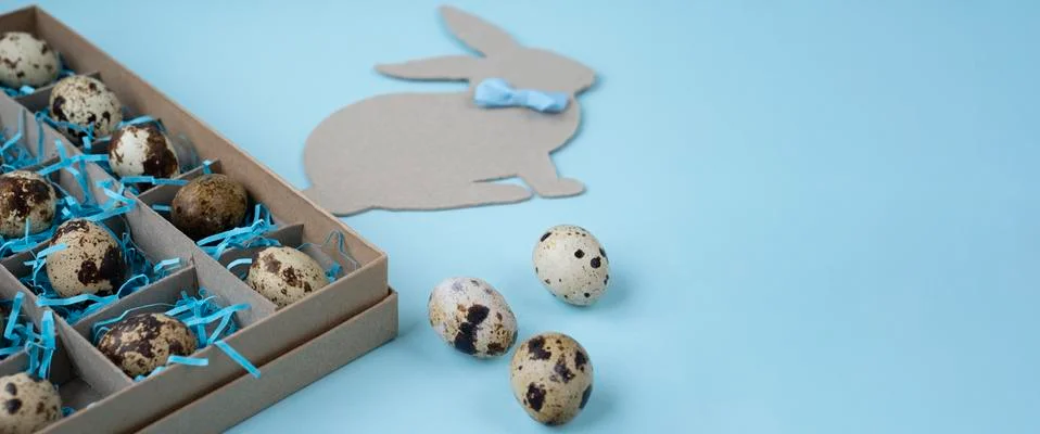 Happy Easter.  Easter background in blue with a box of eggs, an Easter Bunny Stock Photos