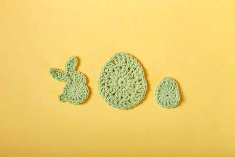 Happy Easter. Easter decoration, bunny rabbitsand eggs made of crochet colorf Stock Photos