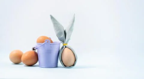 Happy Easter; Easter eggs on blue table background. Easter composition Stock Photos