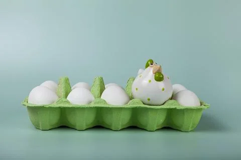 Happy Easter. Easter eggs. Chicken white eggs on green background. Stock Photos