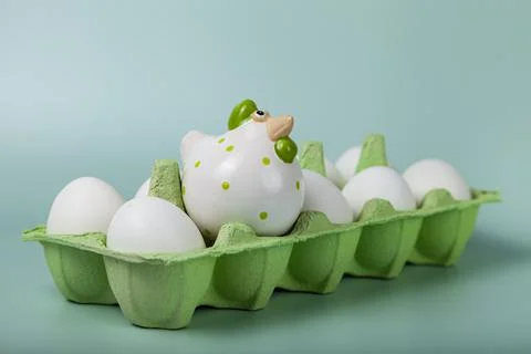 Happy Easter. Easter eggs. Chicken white eggs on green background. Stock Photos