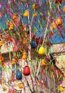Happy Easter. Easter eggs on a tree. Yellow chickens on a tree. Easter tree. Stock Photos