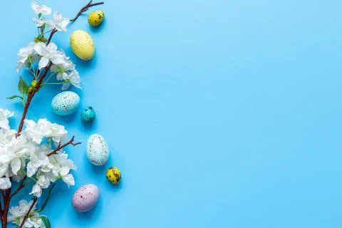 Happy Easter with eggs and flowering branch, top view Stock Photos