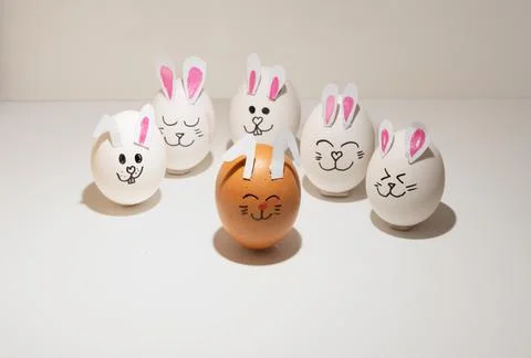 Happy Easter Eggs with Bunny Ears and Faces on white background easter day-1 Stock Photos