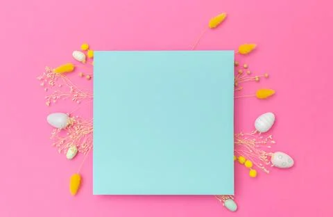 Happy Easter. Empty turchese paper with arrangement of Easter eggs and spri.. Stock Photos