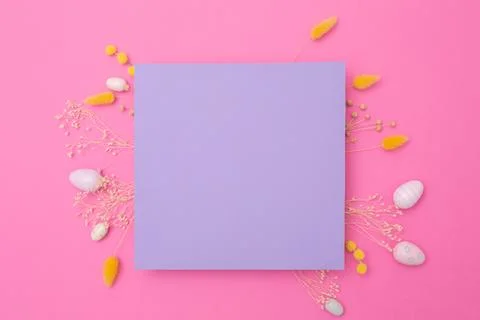 Happy Easter. Empty viola paper with arrangement of Easter eggs and spring dried Stock Photos