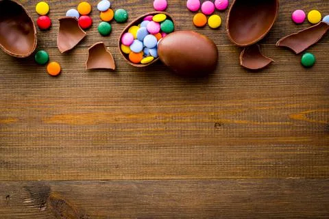 Happy Easter flat lay of chocolate eggs and sweets, top view Stock Photos