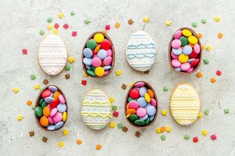 Happy Easter flat lay of chocolate eggs and sweets, top view Stock Photos