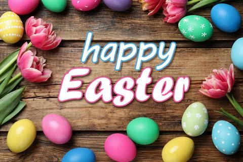 Happy Easter. Frame of colorful eggs and tulips on wooden background, flat la 스톡 사진