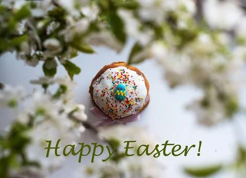 Happy Easter greeting card with Easter cake and blossoming tree branches Stock Photos
