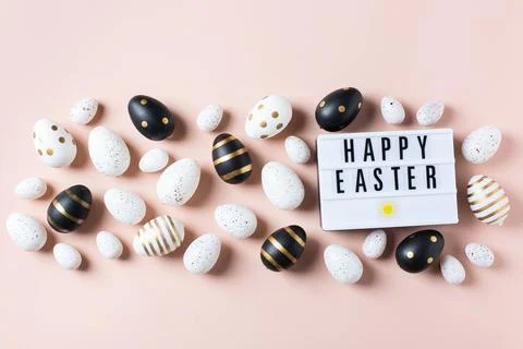 Happy Easter greeting card with eggs on pink background Stock Photos