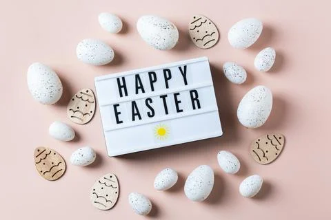 Happy Easter greeting card with eggs on pink background Stock Photos