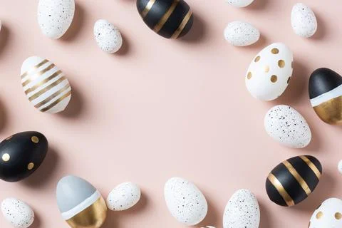 Happy Easter greeting card with eggs on pink background Stock Photos