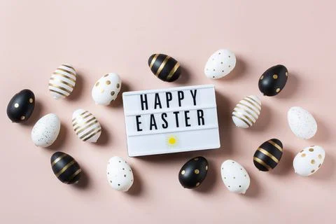Happy Easter greeting card with eggs on pink background Stock Photos
