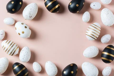 Happy Easter greeting card with eggs on pink background Stock Photos