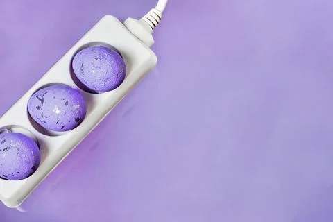 Happy Easter greeting card with electrical switch on purple background Stock Photos