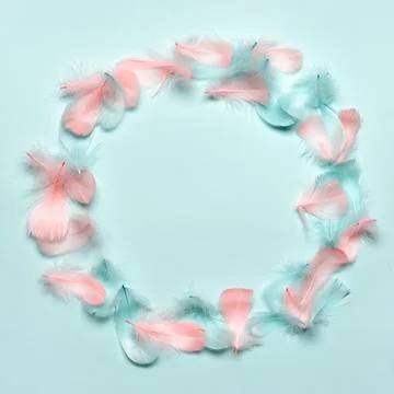Happy easter greeting card template. Round frame made of colorful feathers on Stock Photos