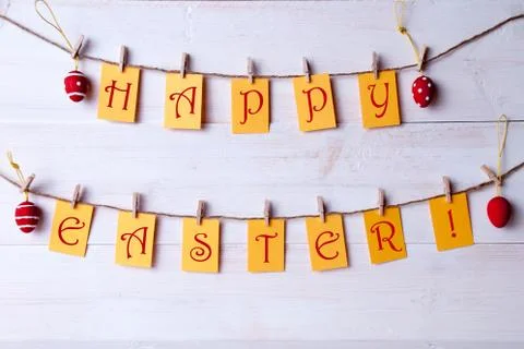 Happy Easter Hanging On Line Four Easter Eggs Stock Photos