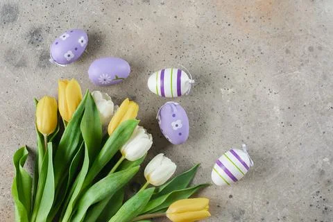 Happy Easter holiday background concept. Tulips flowers and easter eggs. Fl.. Stock Photos