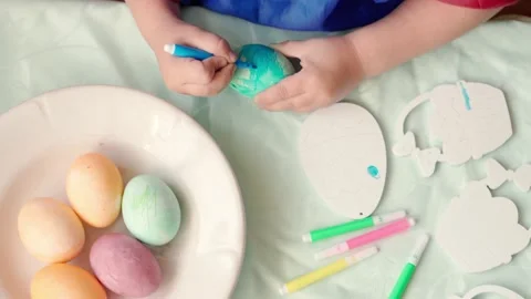 Happy Easter Holiday. Beautiful children paint decorate egg for traditional Stock Footage 157403689