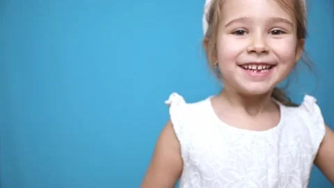 Happy Easter holiday. Portrait of little girl in dress with Easter bunny ears  Stock Footage 300211306