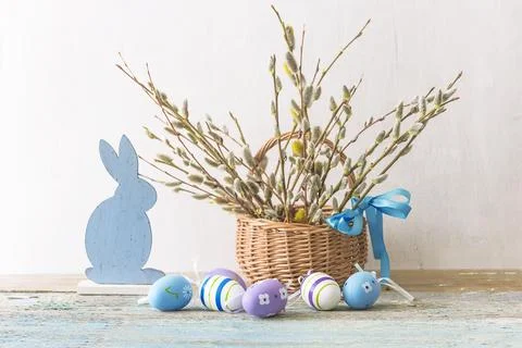 Happy easter holidays concept: Easter eggs, rabbit and bouquet of willow in.. Stock Photos