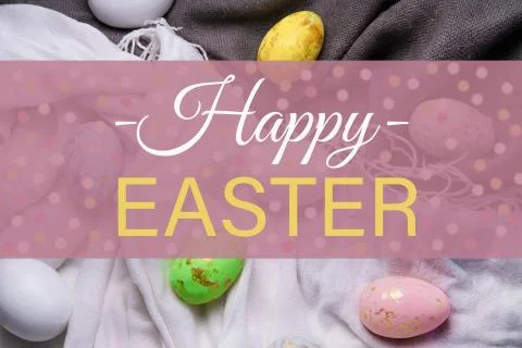 Happy easter. The inscription on the greeting Easter card with eggs, hares on Stock Photos