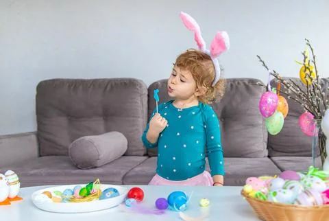 Happy Easter kids with eggs. Selective focus. Stock Photos