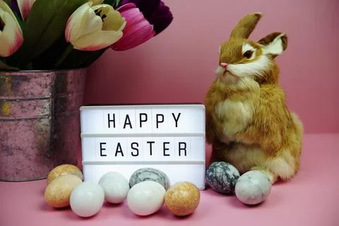 Happy Easter light box with easter element decoration on pink background Stock Photos