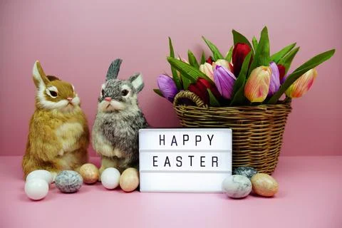 Happy Easter light box with easter element decoration on pink background Stock Photos