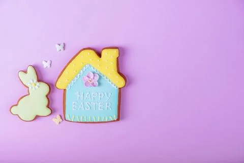 Happy Easter minimalistic background. Multicolored pastel easter cookies on a Stock Photos
